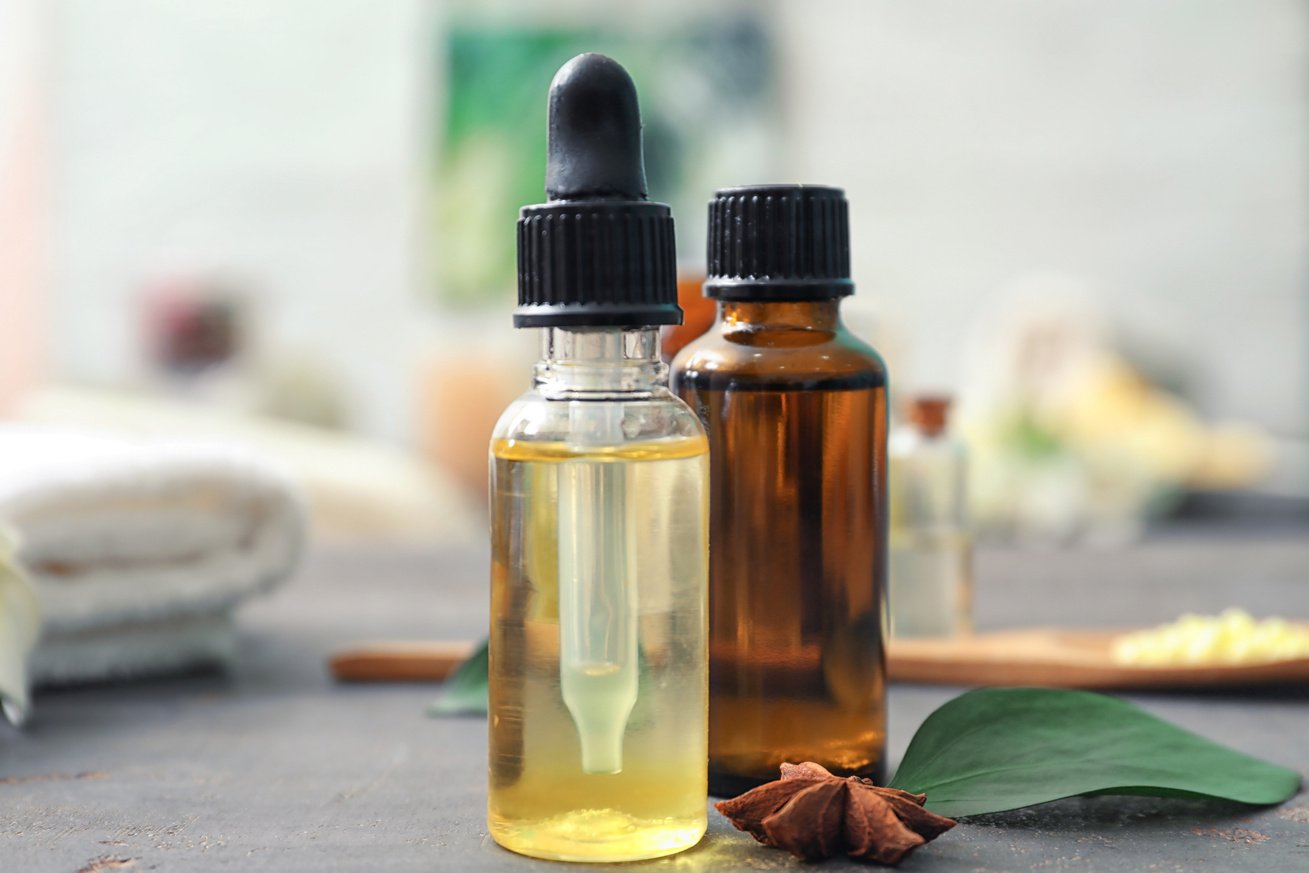 Bottles of Citrus Essential Oil on Table